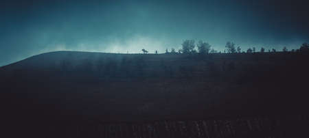 dark fog descending from the mountain after the rain