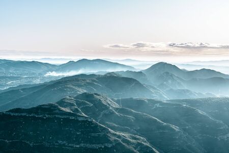 landscape with view of misty mountains