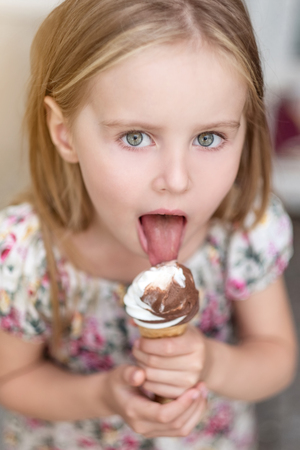 Photo Of Cute Little Girl Eating Ice Id Royalty Free Image Stocklib