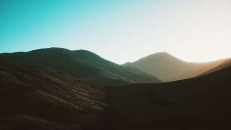 hills with rocks at sunset