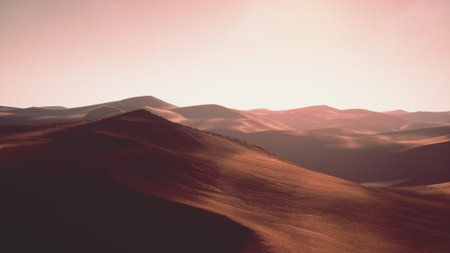 Golden light bathes the vast sand dunes as the sun sets in the desert. Soft curves of the land create a tranquil scene, inviting peace and reflection in the fading daylight.