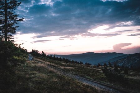 Sunset behind mountains in national park Krkonose, Czech Republic