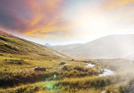 Beautiful creek in mountains at sunrise