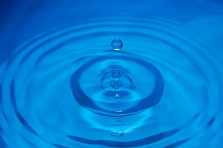 Water drop making a ripple on the surface - Stock Image - Everypixel