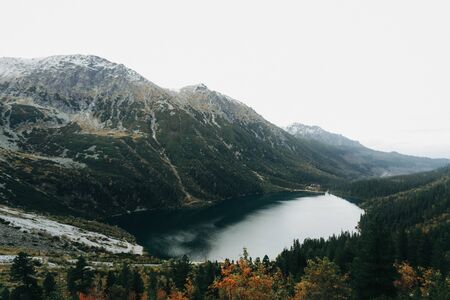 Great mountains landscape Tatry amazing lake Morskie oko in Poland. Incredible clear water.