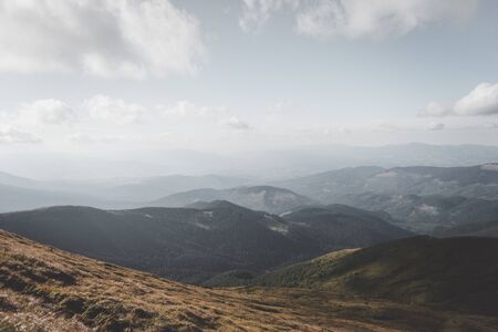 Beautiful sky and bright green grass, convey the atmosphere of the Carpathians.