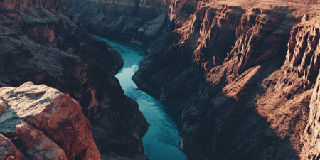 A dramatic canyon at midday, with sheer red rock walls, a winding turquoise river below, and the intense heat of the sun casting deep shadows. The remote and majestic setting feels timeless.